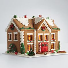 a gingerbread house decorated with christmas decorations