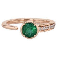 Indulge in the effortless beauty of our Zambian Emerald and Pave Diamond Open Ring. Crafted from 18 karat rose gold, this dazzling piece features a round Zambian emerald paired with pave diamonds. Pave-mounted diamonds on one side of the shank and the  bezel-set emerald with 4-prongs. Handmade from our esteemed H&H Collection, this Open Style Ring is a must-have in Size 6.5! Zambian Emerald and Pave Diamond Open Ring 18kt. Rose Gold 0.50ct Round Zambian Emerald  0.08ct TW F-G VS1 pave diamonds p Effortless Beauty, Zambian Emerald, Zambia, Open Ring, Bezel Setting, Cocktail Rings, Pave Diamonds, Or Rose, Emerald