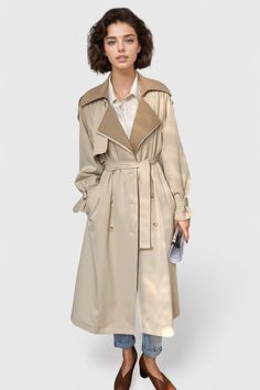 This Double Layered Long Trenchcoat features a double layered collar, long sleeves with tabs, a double breasted closure, and a belt for adjustable fit.Fabric: Cotton, Polyester