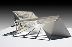 an architectural model of a building on a white surface