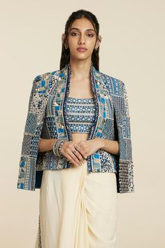 Blue woven jacket with floral, thread, beads and sequins embroidered patchwork.
Components: 1
Pattern: Woven, Embroidered
Type Of Work: Floral, Thread, Beads, Sequins
Sleeve Type: Flared Sleeves
Color: Blue
Other Details: 
Note: Inner and skirt worn by the model are not for sale.
Occasion: Party,Cocktail - Aza Fashions Double Breasted Blazer Outfit Women, Thread Beads, Blazer Outfits For Women, Jacket Fabric, Sequin Sleeve, Blazer Jackets For Women, Woven Jacket, Indian Textiles, Types Of Jackets