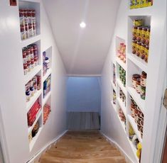 an empty hallway with shelves filled with food