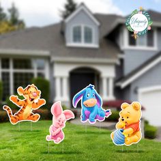 winnie the pooh and friends yard stakers on grass in front of a house