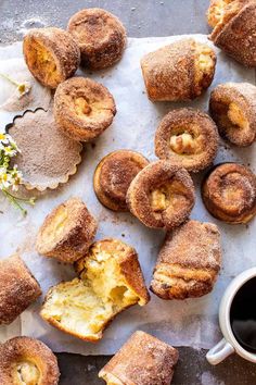 pastries and coffee on a table with flowers