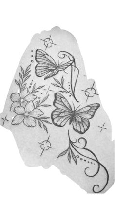 a piece of paper with butterflies and flowers on it's side, in the shape of a heart