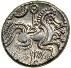 an ancient coin with a dragon on it