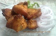 some fried food is on a clear plate