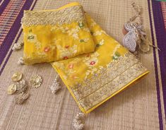 A Lovely Yellow Banarasi Pure Georgette Gota Embroidered Saree. The saree is adorned with intricate gota patti and dabka handwork which makes it all the more a perfect choice for occasion wear. Its a fusion of karigari from Banaras, and Rajasthan. We must say, a truely heirloom piece. The saree is weaved in Banaras. Then the karigars of Rajasthan have worked their magic with the gota embroidery. So its takes about a couple of months for a single saree to be ready. Additional Information Color : Yellow Chinon Traditional Wear With Intricate Embroidery, Yellow Chinon Dupatta With Intricate Embroidery, Yellow Saree With Intricate Embroidery For Eid, Yellow Embroidered Saree For Eid, Gold Banarasi Silk Sharara With Intricate Embroidery, Yellow Silk Traditional Wear With Intricate Embroidery, Gold Banarasi Silk Dupatta With Intricate Embroidery, Yellow Silk Salwar Kameez With Intricate Embroidery, Yellow Saree With Intricate Embroidery