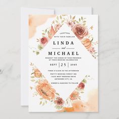 an elegant wedding card with watercolor flowers and leaves on the front, in peach tones