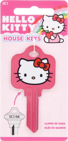 a pink hello kitty key with an image of a cat on the front and back