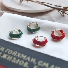 [MATERIAL]: Brass with enamel. [HOOP SIZE]: 20mm or 0.78" Trendy Red Nickel-free Hoop Earrings, Trendy Red Metal Hoop Earrings, Nickel-free Enamel Round Hoop Earrings, Round Enamel Hoop Earrings As A Gift, Trendy Small Hoop Red Earrings, Red Enamel Round Earrings, Red Round Enamel Earrings, Trendy Red Hoop Earrings For Everyday, Trendy Enamel Earrings For Everyday