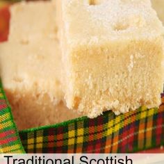 two pieces of white cake sitting on top of a green and yellow plaid table cloth