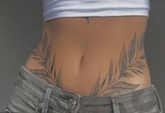 a woman's lower body with tattoos on her stomach and the bottom part of her pants