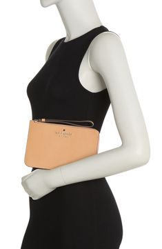 A modern wristlet is the perfect accessory for everyday outfits and more dressy occasions. 5" H x 8" W x 0.5" D Wristlet strap Zip around closure Interior features 4 card slots Exterior features floral print and front zip pocket Synthetic exterior, textile lining Imported Everyday Beige Kate Spade Wallet, Elegant Kate Spade Travel Wallet, Kate Spade Brown Rectangular Wallets, Katespade Wallet, Wristlet Wallet Kate Spade New York, Kate Spade New York, Nordstrom Rack, Card Slots, Slots