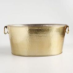 a large gold metal tub with handles