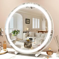 a living room filled with furniture and a round mirror