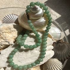 A classic look, this gorgeous antique jade necklace will brighten up many of your favorite outfits with its soft green hue and calming aura. Stone: Jade Bead Measurement: 8.6mm Type: Stone Beaded Strand Length: 17" Weight: 56 grams Sterling Silver Clasp with markMark is the symbol of Longevity Vintage in Excellent Condition Originally knotted, has been re-strung Jade green color is deeper or lighter depending upon lighting Only One Available Free Shipping via USPS in 2 - 7 Days In Chinese Cultur Green Jade Necklace, Jade Green Color, Jade Bead Necklace, Antique Jade, Antique Green, Boost Your Mood, Jade Necklace, Jade Beads, Green Jade