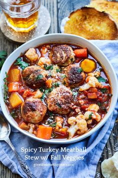 a bowl of stew with meatballs and vegetables