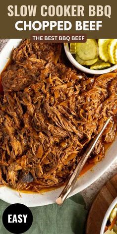 slow cooker bbq chopped beef on a plate with pickles