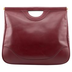 Late 1970's-early 1980's Hermes oversize foldable cut out handle shopper in burgundy box leather. Not often seen and this one is in perfect condition. Spring set metal opening allows great access. Very unique piece, can be worn 2 ways folded down as a large clutch or fully open as a convenient shopper for your day at the mall! Does not come with original box or dust cover. 17" L x 20" H 10.25" open. Maroon Leather, Large Clutch, At The Mall, Spring Set, Leather Cuts, Shopper Tote, Dust Cover, Fashion Handbags, Unique Pieces