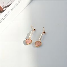 Description:Chic Pearl Heart EarringsSpecifications:Material: Eco-plated Copper, Pearl, 24k GoldSize: 3.3 cm * 1.8 cmWeight: 5 g/pair "Add a touch of elegance and love to your outfit with these Chic Pearl Heart Earrings. Perfect for any occasion, these earrings will make you stand out with their unique design. Embrace your playful side with these trendy earrings!" Real Earrings, Pink Heart Pendant, Earrings Outfit, Pink Heart Earrings, Jewelry Details, Copper Pearl, Pearl Heart, Heart Dangle Earrings, Heart Drop Earrings