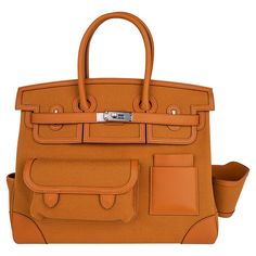 Mightychic offers an Hermes Cargo Birkin 35 bag featured in golden Sesame. This Hermes limited edition utility Birkin bag is created with Goeland canvas and Swift leather trim. Includes front and rear snap pockets, exterior credit card holder, a removable side cup holder and a pocket at the side gusset. Interior is canvas. Palladium hardware. NEW or NEVER WORN. final sale BAG MEASURES: LENGTH 35 cm / 14" TALL 25 cm / 10" DEEP 18 cm / 7" HANDLES: TALL 5" CONDITION: NEW or NEVER WORN Hermes Canvas Bag, Hermes Cargo, Cargo Birkin, Hermes Limited Edition, Hermes Bags, Leather Outfit, Credit Card Holder, Hermes Bag, Arm Candy