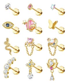 an assortment of gold piercings with different designs and colors, including pink, blue, green