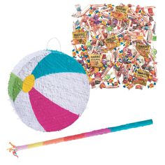 a beach ball, pinatas and stickers on a white background next to it