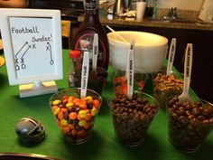 a table topped with bowls filled with candy