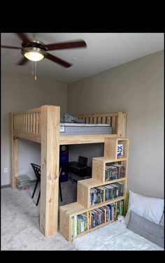 a loft bed with stairs and bookshelves in a bedroom