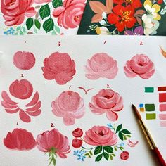 some watercolors are being used to paint flowers