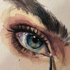 a drawing of an eye with watercolor pencils