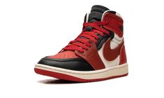 The Women’s Air Jordan 1 High MM “Sport Red” is the women’s sizing of the modified version of the retro basketball shoe with a layered aesthetic.  The Jordan 1 High MM is made from a unique combination of leather and canvas materials layered on top of one another.  Specifically, the shoe has layered and raised overlay panels that give the design a head-turning look.  The upper features a Sport Red perforated leather toe contrasted with a Dune Red raised leather overlay on the forefoot, a black r Red Jordans, Retro Basketball Shoes, Retro Basketball, Leather And Canvas, Stadium Goods, Air Jordan 1 High, Jordan 1 High, Perforated Leather, Red Shoes