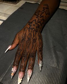 a woman's hand with black and white designs on it