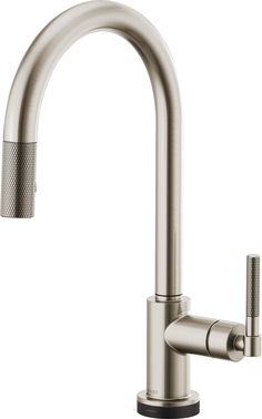 the kitchen faucet is stainless steel and has an adjustable spout for water