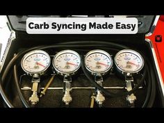 four gauges in the back of a car with an instruction sign on it that says,'carb sync made easy '