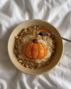 a bowl filled with oatmeal topped with sliced oranges