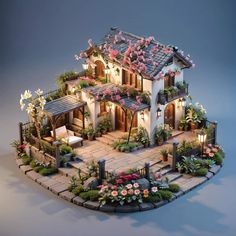 a model house with lots of flowers on the roof