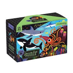 a puzzle box with an image of dolphins and other animals