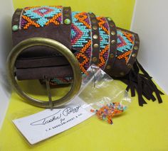 Never Worn Vintage Tasha Polizzi women's wide belt with original tag wide Southwestern seed beaded faux turquoise studs brass studs, brass belt buckle chocolate brown genuine suede leather belt. Length 41 & 1/2 inches. Length with fridge adds 6 & 1/4 inches to the length. Total length 47 & 3/4 inches. Width  3 inches.  I offer multiple-item order shipping discounts. Wide Belts For Women, Tasha Polizzi, Brass Belt, Brass Belt Buckles, Belt Length, Studded Belt, Unique Flowers, Suspender Belt, Wide Belt