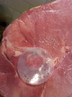 a piece of meat sitting on top of a cutting board