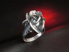 "Oxidized sterling silver rose ring. Hallmark: 925 Approximate weight: 8.1 g Width: 0.82 inches Shipping: - we prepare our orders ready for shipping in 3-7 business days, all items are made to order, they are not kept in stock; - we will provide tracking number as soon as order will be shipped. EXPRESS shipping: if you are interested in FAST delivery, we offer very fast and high quality \"door to door\" service by UPS Express. Delivery: within Europe - 1 business day, within USA, Canada and Aust Rose Sterling Silver Promise Ring, Formal Rose Gold Sterling Silver Flower Ring, Rose Flower Sterling Silver Wedding Ring, Rose Flower Ring In Sterling Silver For Wedding, Rose Color Sterling Silver Flower Ring For Wedding, Sterling Silver Rose Flower Ring For Wedding, Sterling Silver Rose Flower Ring For Anniversary, Elegant Sterling Silver Rings With Roses, Rose Sterling Silver Ring Gift