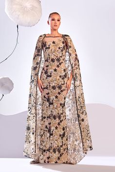 Description Gold Column, Long dress Sleeveless Closed neckline Embroidered lace Modifications Accepted Custom Measurements Accepted Dry Clean Evening Dress Made in Lebanon 873 Luxury Embroidered Dress For Reception, Luxury Floor-length Dresses With Intricate Embroidery, Elegant Lace Dress With Cape Sleeves, Lace Gown With Intricate Embroidery For Gala, Luxury Floral Embroidery Dress For Gala, Sleeveless Embroidered Dress For Reception, Luxury Dresses With Intricate Embroidery For Reception, Elegant Gown With Intricate Embroidery And Cape Sleeves, Luxury Cape Dresses For Wedding