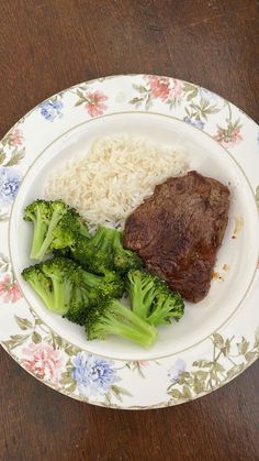 broccoli, rice and beef on a floral plate