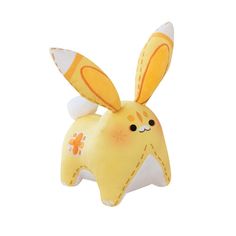 a yellow stuffed animal with an orange and white bunny on it's back legs