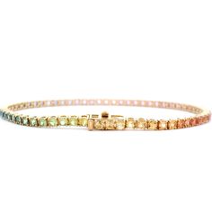 Indulge in the poetic beauty of this exquisite 5.31 Cts. Pastel Rainbow Sapphire Tennis Bracelet. With a dreamy palette of pastel sapphires, this premium piece exudes elegance and grace. Perfect for adding a touch of luxury to any outfit, this bracelet is a must-have for any jewelry collection. GEMS 5.31 RD TCW 65 PCS. RAINBOW18K YG 8.92 GRAMS SIZE 7" MD-104 Elegant Multicolor Diamond Bracelet For Formal Occasions, Elegant Multi-stone Diamond Bracelet, Elegant Multicolor Diamond Bracelet, Elegant Multicolor Multi-stone Tennis Bracelet, Elegant Multicolor Tennis Bracelet For Formal Occasions, Elegant Formal Multicolor Tennis Bracelet, Elegant Multicolor Diamond Bracelet As Gift, Elegant Multicolor Tennis Jubilee Bracelet, Elegant Multicolor Jubilee Tennis Bracelet