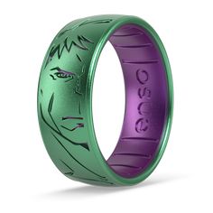 a green and purple ring with an image of the face of jesus on it's side