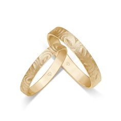 two gold wedding bands on white background