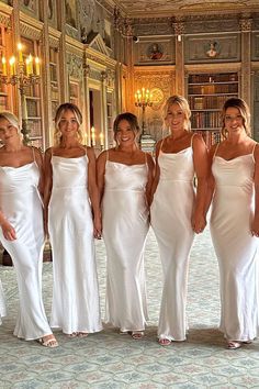 the bridesmaids are all dressed in white dresses