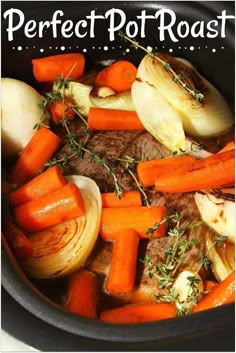 a pot filled with carrots, onions and meat